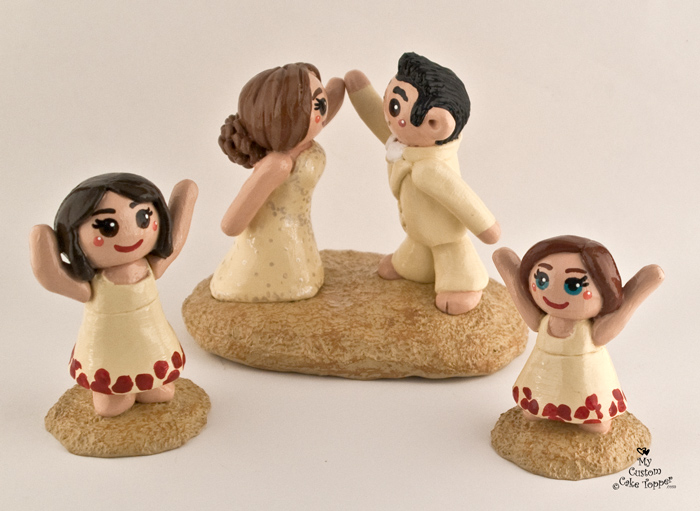 Bride and Groom High Fiving Daughters  Cheering Cake  